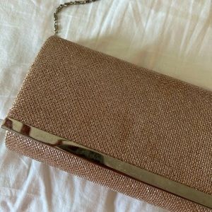 Sparkly long strap clutch bag